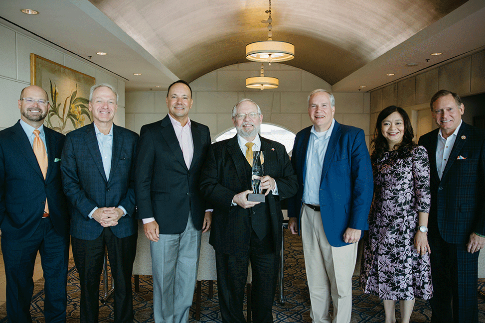 Dr. John Hellerstedt (center), commissioner of the Texas Department of State Health Services (DSHS), received the THA Trustee Award for his steadfast and sound public health leadership during COVID-19, and for his long and distinguished career in public service prior to the pandemic.